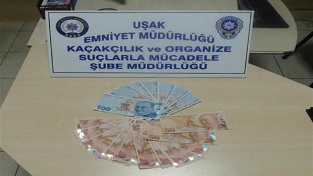 Kitap arasında bin 400 TL sahte para