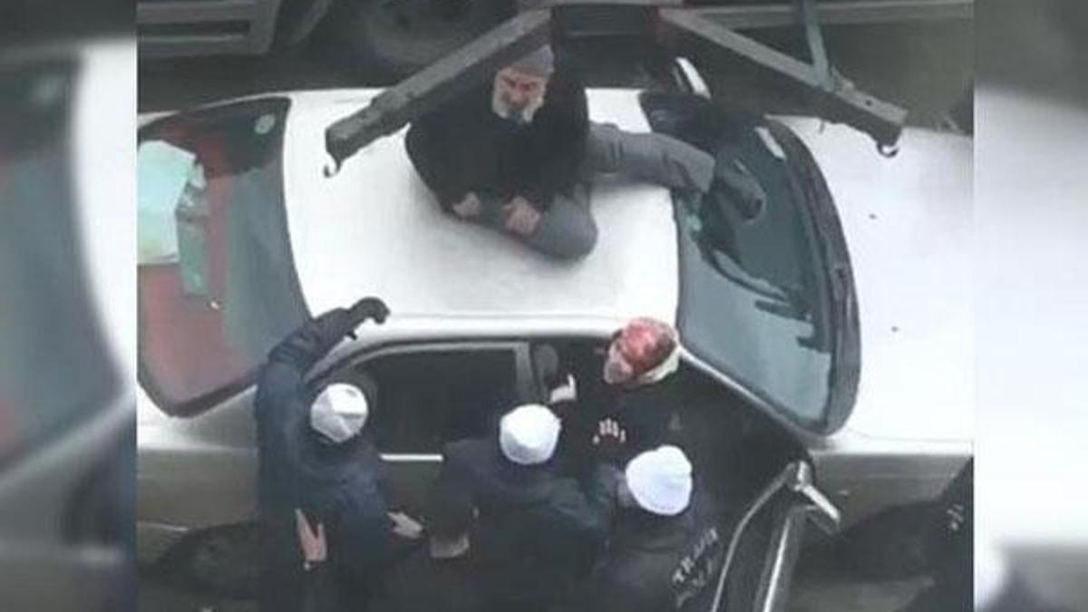 Otomobilini çektirmemek için üzerine çıktı!
