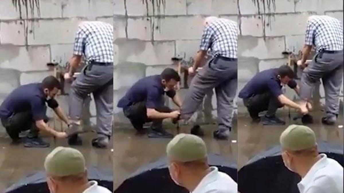Abdest alan yaşlı adama çoraplarını giydiren komiser yardımcısına övgü