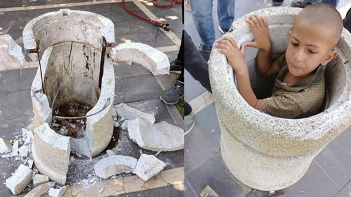 Beton çöp kovasına sıkışan çocuk güçlükle kurtarıldı