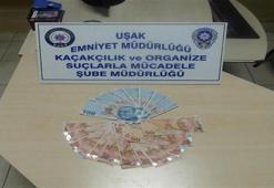 Kitap arasında bin 400 TL sahte para