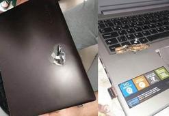 Teröristin kurşunu şans eseri laptopa denk geldi