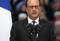 Hollande'ın konuşması sırasında, keskin nişancı polisin silahı ateş aldı
