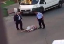 Yerde yatan kadını döven polisler açığa alındı!
