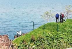 2 gündür kayıp olarak aranırken, denizde taş dolu çantaya zincirlenmiş cesedi bulundu