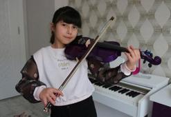 Di George sendromlu Neda müzik tutkusuyla hayata  bağlandı