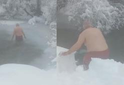 Gümüşhane'de 70 yaşındaki adam buz tutan gölde yüzüyor