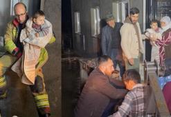 Manisa'da selde mahsur kalan 11 kişilik aileyi itfaiye kurtardı