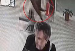 Banka şubesinde işlem yaparken üzerine kedi düştü