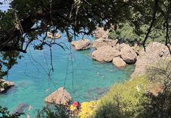 Antalya'da asansörle inilip serin sulara atlanıyor: Turistler akın akın orada toplanıyor!