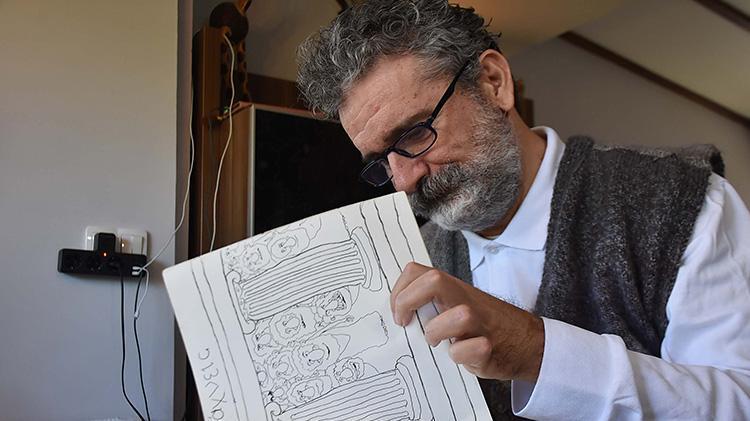 Trafik kazasında felç geçirdi, çizdiği karikatür onu hayata bağladı