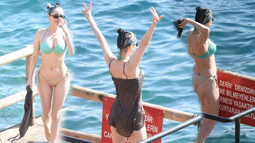 Ünlü şarkıcı Elif Kaya gecelikle denize girdi