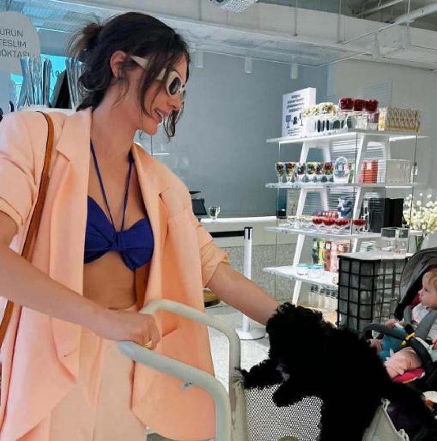 Burcu Özberk ceketinin içine bikini giydi, olay oldu!