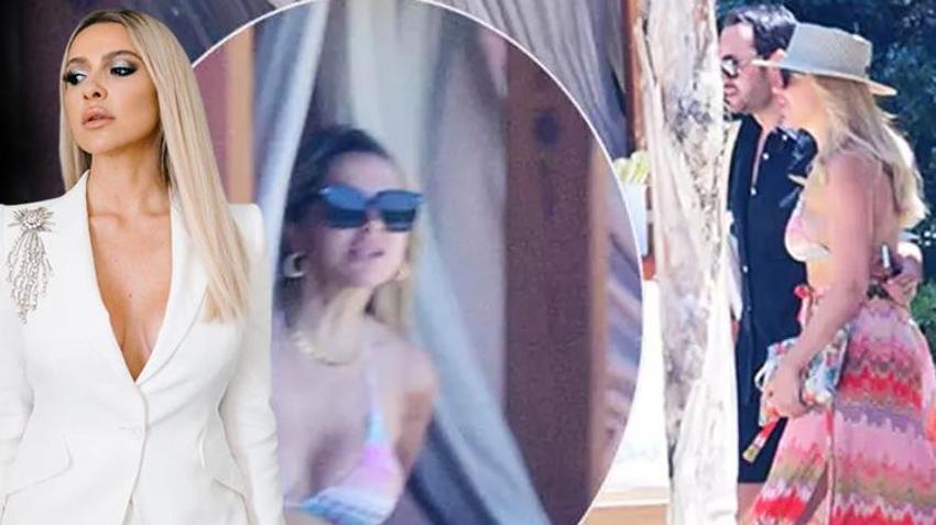 Hadise’nin güneşlendiği kabananın perdelerini örttü! Plajda önlem