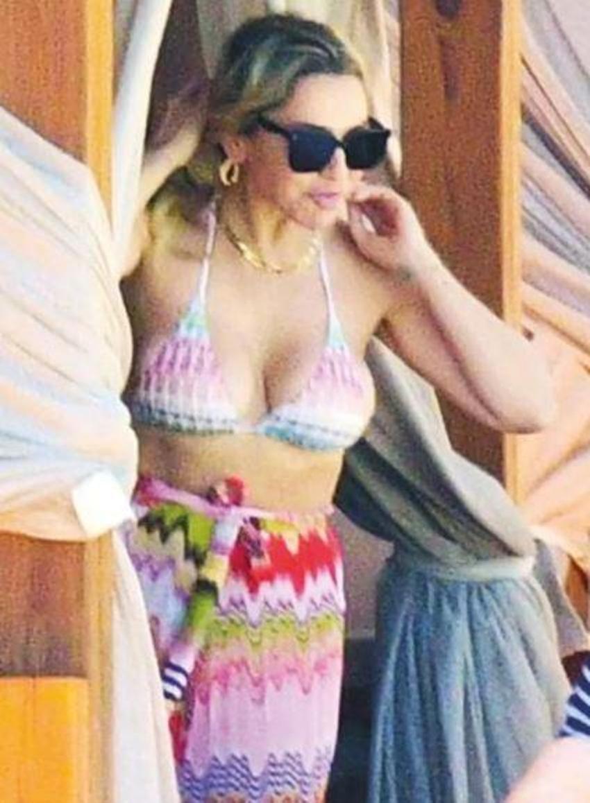 Hadise’nin güneşlendiği kabananın perdelerini örttü! Plajda önlem