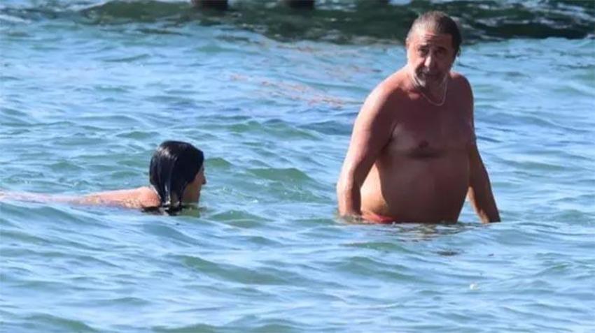 Ünlü oyuncu Hakan Meriçliler'den pahalılığa çözüm: Sevgilisiyle halk plajına gitti