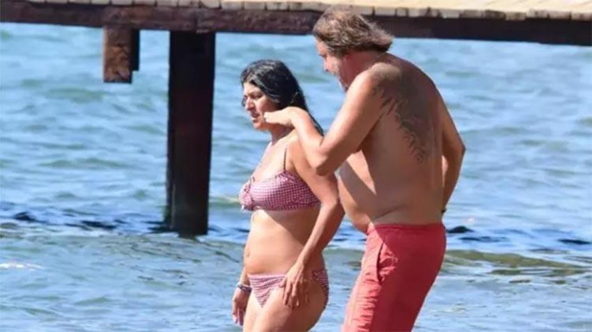 Ünlü oyuncu Hakan Meriçliler'den pahalılığa çözüm: Sevgilisiyle halk plajına gitti