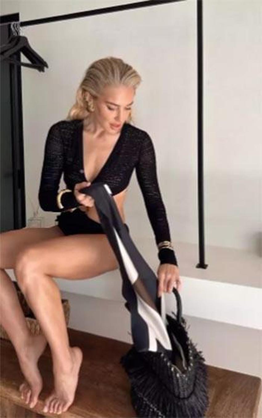 Burcu Esmersoy önce bikinisini tanıttı, ardından serin sulara atladı