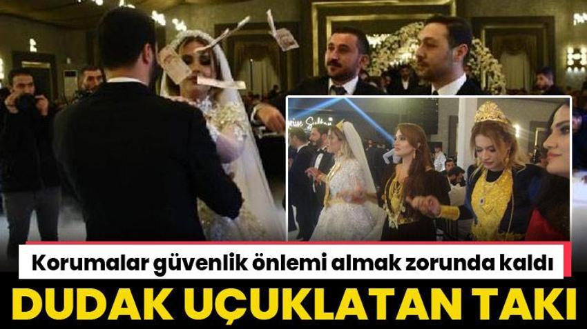 Düğünde dudak uçuklatan takı! Korumalarla güvenlik önlemi alındı
