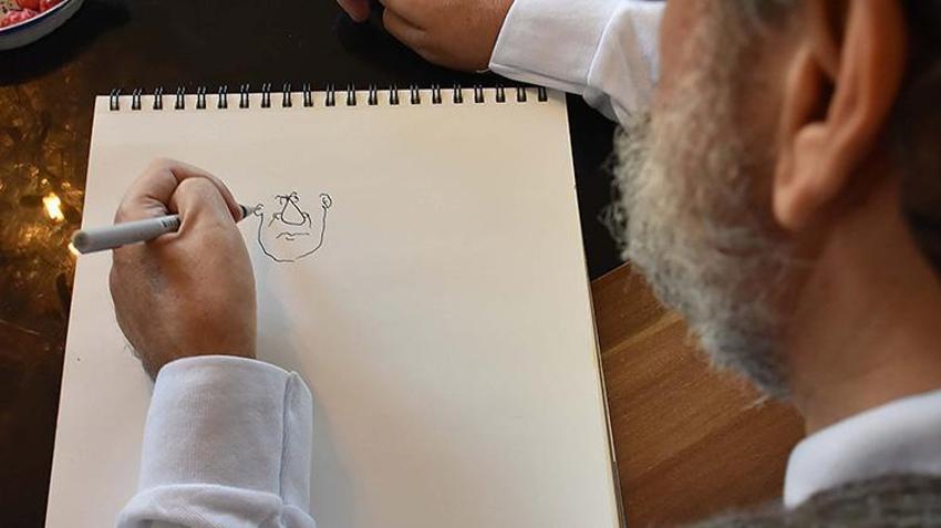 Trafik kazasında felç geçirdi, çizdiği karikatür onu hayata bağladı